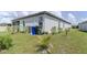 Green backyard, offering a serene view and plenty of space for outdoor activities at 6300 Dolostone Dr, Lakeland, FL 33811