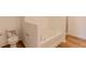 Bright bathroom showcasing a toilet, bathtub, and glass-enclosed shower with wood-look flooring at 6300 Dolostone Dr, Lakeland, FL 33811