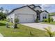 Charming single-Gathering home with a two-car garage and a well-maintained front yard at 6300 Dolostone Dr, Lakeland, FL 33811