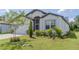 Well-manicured lawn and landscaping accentuate this attractive single-Gathering home at 6300 Dolostone Dr, Lakeland, FL 33811