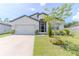 Charming single Gathering home featuring a well maintained lawn and two car garage at 6300 Dolostone Dr, Lakeland, FL 33811