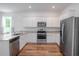 Modern kitchen with stainless steel appliances, granite countertops, and ample cabinet space for storage at 6300 Dolostone Dr, Lakeland, FL 33811