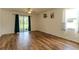 Open concept living space with ceiling fan and sliding glass doors at 6300 Dolostone Dr, Lakeland, FL 33811