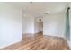 Bright living room featuring hardwood floors and neutral walls, creating a welcoming and versatile space at 6300 Dolostone Dr, Lakeland, FL 33811