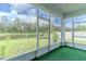 An enclosed back porch with green indoor-outdoor carpet and screens at 6300 Dolostone Dr, Lakeland, FL 33811