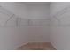 Spacious walk-in closet featuring wire shelving, carpeted floor, and neutral-colored walls at 6300 Dolostone Dr, Lakeland, FL 33811