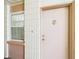 Apartment entrance featuring a pink door, with a window at 700 Mirror Nw Ter # 702, Winter Haven, FL 33881