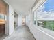 Enclosed balcony offers beautiful views of the lake and surrounding landscape at 700 Mirror Nw Ter # 702, Winter Haven, FL 33881