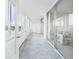 Enclosed balcony with sliding glass doors offers natural light and serene views at 700 Mirror Nw Ter # 702, Winter Haven, FL 33881
