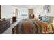 Comfortable bedroom with natural light, warm-toned furnishings, and a tranquil ambiance for restful sleep at 700 Mirror Nw Ter # 702, Winter Haven, FL 33881