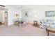 Bright dining area features a glass table, four chairs, and wall art at 700 Mirror Nw Ter # 702, Winter Haven, FL 33881