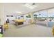 Bright exercise room with various fitness equipment and natural light from large windows at 700 Mirror Nw Ter # 702, Winter Haven, FL 33881