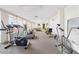 Well-equipped exercise room featuring treadmills, elliptical machines, and other fitness equipment at 700 Mirror Nw Ter # 702, Winter Haven, FL 33881