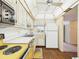 Cozy kitchen with white and gold trimmed cabinets and classic appliances at 700 Mirror Nw Ter # 702, Winter Haven, FL 33881
