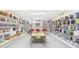Extensive library filled with books and a central table surrounded by chairs at 700 Mirror Nw Ter # 702, Winter Haven, FL 33881