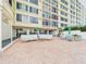 Inviting patio seating area with comfortable couches and chairs near the building at 700 Mirror Nw Ter # 702, Winter Haven, FL 33881