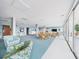 Bright recreation room featuring seating, tables, and tasteful decor near the large windows at 700 Mirror Nw Ter # 702, Winter Haven, FL 33881