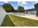 A spacious backyard with a pool and lush greenery, offering a serene outdoor retreat and relaxation at 704 Butternut Pl, Lakeland, FL 33813