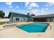 Backyard with a pool, patio, fenced perimeter and ample entertainment space at 704 Butternut Pl, Lakeland, FL 33813