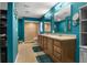 Bright bathroom with dual vanity, walk-in shower, and tiled flooring at 704 Butternut Pl, Lakeland, FL 33813