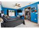 Bright bedroom with a black comforter, window, and large closet at 704 Butternut Pl, Lakeland, FL 33813