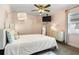 Bedroom featuring a double bed, large mirror, wall art, and neutral colored carpet at 704 Butternut Pl, Lakeland, FL 33813