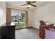 Home office space with large window for natural light and neutral colored carpet at 704 Butternut Pl, Lakeland, FL 33813
