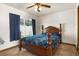 Cozy bedroom with a window and plush bedding at 704 Butternut Pl, Lakeland, FL 33813