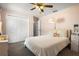 Cozy bedroom with a double bed, carpet floor, and a ceiling fan at 704 Butternut Pl, Lakeland, FL 33813