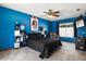 Bright bedroom featuring a fan and lots of shelving at 704 Butternut Pl, Lakeland, FL 33813