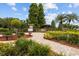 Landscaped community park with benches, walkways, and gazebo, offering a scenic and relaxing outdoor space at 704 Butternut Pl, Lakeland, FL 33813