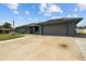 Well-maintained home with a spacious driveway and attached two-car garage at 704 Butternut Pl, Lakeland, FL 33813
