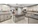 Bright eat-in kitchen features stainless steel appliances and center island at 704 Butternut Pl, Lakeland, FL 33813