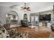 Open living room features wood floors and view of kitchen at 704 Butternut Pl, Lakeland, FL 33813