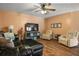 Comfortable living room with hardwood floors and recliner chairs at 704 Butternut Pl, Lakeland, FL 33813