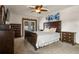 This main bedroom features a large bed with wooden furniture at 704 Butternut Pl, Lakeland, FL 33813