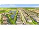 Beautiful aerial view of a new home community with a lake and lush green landscape at 7247 Oakmoss Loop, Davenport, FL 33837