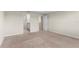 Bedroom with neutral carpet, ensuite bathroom, and a bright interior at 7247 Oakmoss Loop, Davenport, FL 33837
