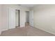 Bedroom with closet and a doorway leading to other rooms at 7247 Oakmoss Loop, Davenport, FL 33837