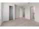 Large bedroom featuring carpet, a walk-in closet, and an ensuite bathroom at 7247 Oakmoss Loop, Davenport, FL 33837