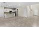 Open floor plan with a modern kitchen, tile flooring, and easy access to all living areas at 7247 Oakmoss Loop, Davenport, FL 33837