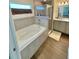 Well-lit bathroom with a tub, enclosed shower, and a vanity, offers a serene and spa-like atmosphere at 737 Daphne Dr, Polk City, FL 33868