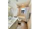 Bathroom featuring a tub and shower combination, complete with modern fixtures and an efficient vanity at 737 Daphne Dr, Polk City, FL 33868