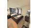 A cozy bedroom featuring a dark accent wall and comfortable bedding, ideal for rest and relaxation at 737 Daphne Dr, Polk City, FL 33868