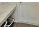Laundry room with front load machines under a solid surface folding table. Perfect and convenient at 737 Daphne Dr, Polk City, FL 33868