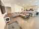 Spacious living area with recessed lighting, laminate flooring, and seamless integration to the kitchen space at 737 Daphne Dr, Polk City, FL 33868
