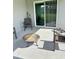 Outdoor patio space with seating and a fire pit offers space for entertaining at 737 Daphne Dr, Polk City, FL 33868