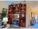 Beautiful custom bar with wine fridge, lighting, and ample storage at 741 Canberra Rd, Winter Haven, FL 33884