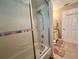 Bathroom featuring a shower-tub combo and a white vanity at 741 Canberra Rd, Winter Haven, FL 33884