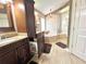 Bathroom featuring a glass shower, soaking tub, and built-in laundry hamper in cabinetry at 741 Canberra Rd, Winter Haven, FL 33884